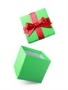 Classic green flying open gift box with red satin bow Royalty Free Stock Photo