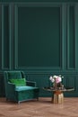 Classic green interior with armchair, coffee table, flowers and wall moldings.