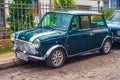 Classic green Morris Mini Cooper car parked