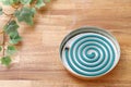 Classic green mosquito coil in a metal plate