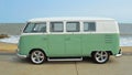 Classic Green and white VW Camper Van parked on Seafront Promenade. Royalty Free Stock Photo