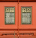 Classic green wood window at the orange concrete building. Royalty Free Stock Photo