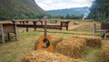 Classic guitar lying in front of the nature as Royalty Free Stock Photo