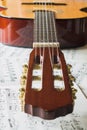 Classic guitar on mucic notes Royalty Free Stock Photo