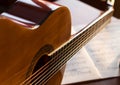 Classic guitar on mucic notes Royalty Free Stock Photo