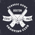 Classic Guns emblem, logo with crossed powerful pistols, guns, two handguns on ribbon