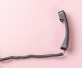 Classic handset with a wire on a pink background Royalty Free Stock Photo