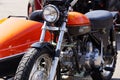 Classic Harley Davidson motorbike and sidecar parked on the edge of a paved road