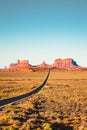 Classic highway view in Monument Valley at sunset, USA Royalty Free Stock Photo
