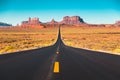 Classic highway view in Monument Valley at sunset, USA Royalty Free Stock Photo