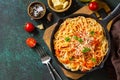 Classic homemade italian spaghetti pasta with tomato sauce, cheese parmesan and basil on dark stone table. Top view, flat lay Royalty Free Stock Photo