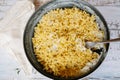 Classic Homemade Macaroni and Cheddar Cheese on black plate with a fork on white wooden table. Top view Royalty Free Stock Photo