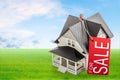 Classic house model on sale on blurred background Royalty Free Stock Photo