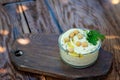 Classic hummus appetizer of chickpeas, tahini, olive oil, and oriental spices in a bowl on a wooden table. Traditional Royalty Free Stock Photo