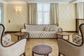 Classic interior of beige living room.