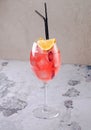 Classic Italian Aperol Spritz cocktail consisting of prosecco, aperitif and soda water with orange slice fresh fruit in