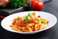 Classic italian pasta penne alla arrabiata with basil and freshly grated parmesan cheese