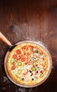 Classic Italian pizza on a wooden tray, served in a small authentic Italian restaurant Royalty Free Stock Photo