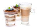 Classic tiramisu dessert with blueberries in a glass and cup of coffee isolated on a white background with clipping path Royalty Free Stock Photo