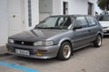 Classic Japanese car, the small Toyota Corolla XL EE90 in gray color parked in the street