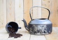 Classic kettle with black coffee cup and coffee beans