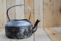 Classic kettle on wood panels