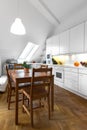 Classic kitchen with wooden table and parquet floor