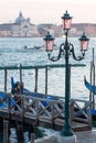 Vintage lamppost with Venice lagoon in the background in Venice, Italy