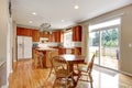 Classic large wood kitchen interior with hardwood floor.