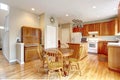 Classic large wood kitchen interior with hardwood floor.