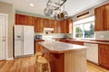 Classic large wood kitchen interior with hardwood floor.