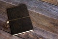 Classic Leather Bound Journal Book on a Old Barn Board Floor Close Up Royalty Free Stock Photo