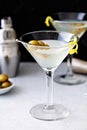 Classic lemon drop martini with olives and lemon