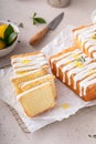 Classic lemon pound cake with powdered sugar glaze dripping over