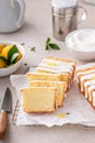 Classic lemon pound cake with powdered sugar glaze dripping over