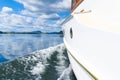 Classic lines of retro restored boat rippling surface water