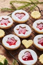 Classic Linzer Christmas Cookies with raspberry or strawberry jam on wooden table Royalty Free Stock Photo