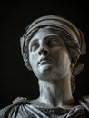 Classic marble statue of a woman on a dark background Royalty Free Stock Photo