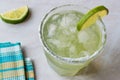 Classic Margarita Cocktail in Salted Glass with Lime and Crushed ice. Royalty Free Stock Photo