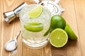 Classic margarita cocktail with salty rim on wooden table Royalty Free Stock Photo