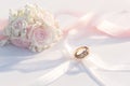 Classic matrimony Golden rings with white and pink ribbon background