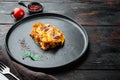 Classic meat lasagna with cheese Bechamel and Bolognese sauce, on plate, on old dark  wooden table background, with copy space for Royalty Free Stock Photo