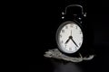 Classic mechanical alarm clock on dark background