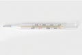 Classic Medical glass mercury thermometer for measuring body temperature isolated on a white background.ÃÂ¡lose-up photo Royalty Free Stock Photo