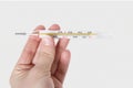 Classic Medical glass mercury thermometer for measuring body temperature  on a white background. Royalty Free Stock Photo