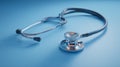 Classic medical stethoscope resting on a deep blue background Royalty Free Stock Photo