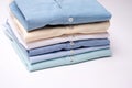 Classic men`s shirts stacked on white background. Royalty Free Stock Photo