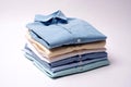 Classic men`s shirts stacked on white background. Royalty Free Stock Photo