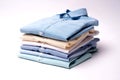 Classic men`s shirts stacked on white background. Royalty Free Stock Photo