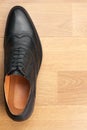 Classic mens shoes stand on the wooden floor